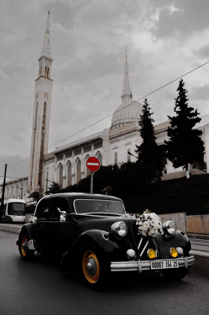 Vintage wedding car parked on urban British street, retouched with Photoshop dodge & burn, gradient maps, and tonal adjustments for cinematic realism