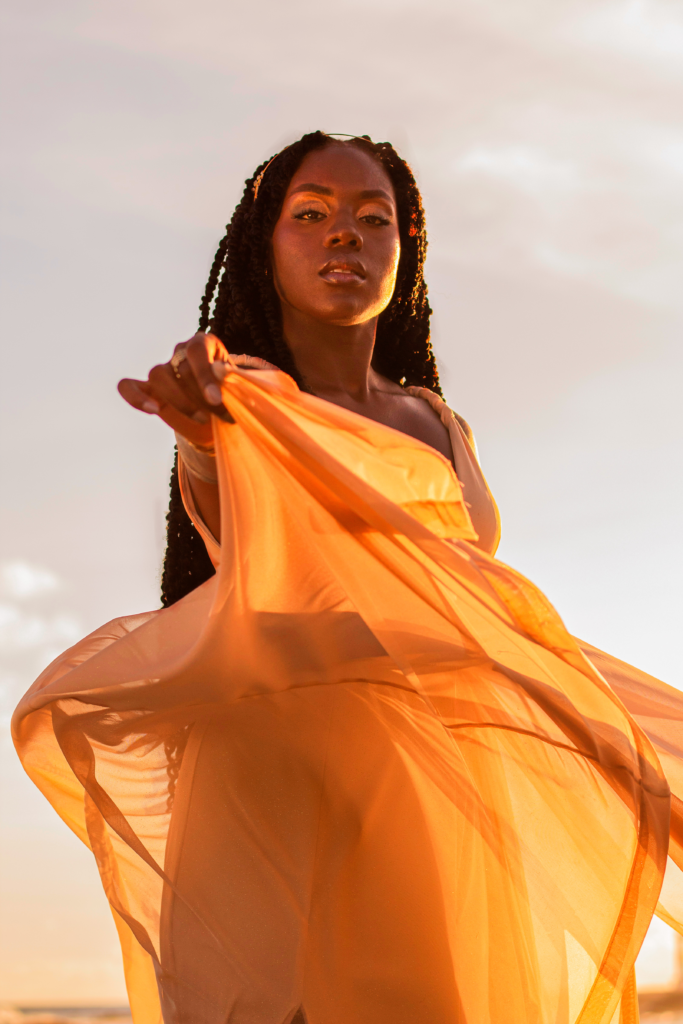 Sahara in golden fashion outfit, retouched with Photoshop dodge & burn, frequency separation, and cyber-luxe gradient maps for Gen-Z editorial impact.