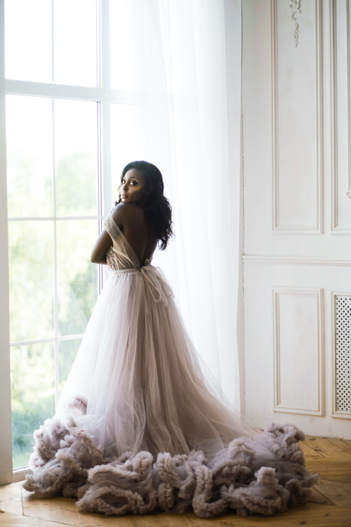 Elegant woman in modern wedding dress, retouched with Photoshop dodge & burn, frequency separation, and golden hour LUTs for cinematic softness and editorial clarity.